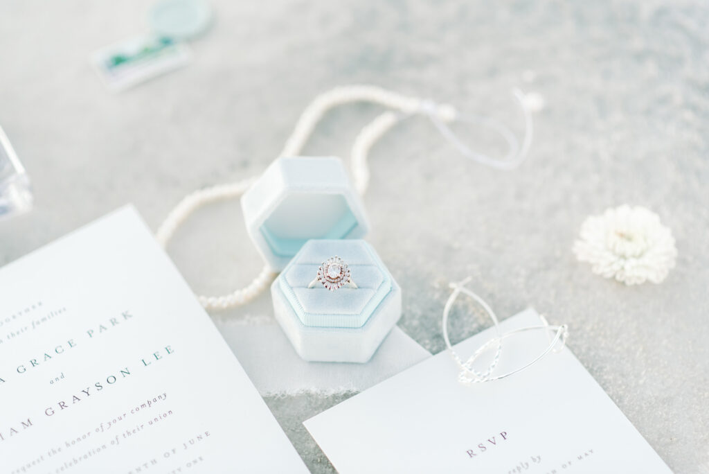 Gorgeous flat lay detail picture of her ring and the invitation suite during an elopement out at the Bonneville Salt Flats in Utah